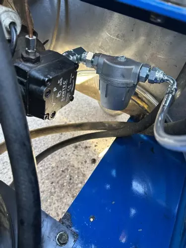 Industrial fuel filter installed on Nilfisk DTE 500HM hot pressure washer during contaminated fuel repair in Leicester.